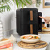 Black dual drawer air fryer, top view with both baskets open