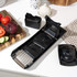 Black and stainless steel mandoline slicer with grater, side view