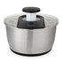 Stainless steel salad spinner with black and clear lid, shown on white background