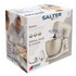 Cream stand mixer with whisk attachment on kitchen counter, shown with baked goods