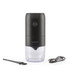 Black cordless electric coffee grinder with clear container, cleaning brush and USB charging cable.
