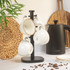 Kitchen scene with Salter black kettle and mug tree holding four cream ceramic cups.