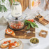 Cream electric food chopper base with Salter logo, close-up of button being pressed