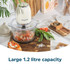 Cream electric food chopper with glass bowl, viewed from above
