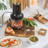 Salter black and gold electric mini chopper, shown upright with clear bowl