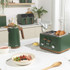 Green saucepan with wood effect handle, top down view, lid on