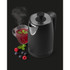 Matte black electric kettle with stainless steel lid, next to a glass cup of tea and mixed berries.