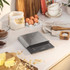 Salter digital kitchen scales in silver on worktop with baking ingredients