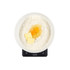 Baking ingredients in white bowl on Salter kitchen scale: flour, butter, and eggs.