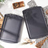 Grey non-stick baking tray with raised edges, viewed from above.