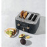 4-slice grey toaster with toasted bread, shown with avocado toast on a plate
