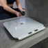 White digital bathroom scale with metal pads on concrete surface