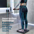 Bathroom scales in use, person holding hand grips; technology demo for precise body measurement.