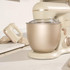 Cream stand mixer and matching hand mixer on kitchen counter