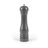 Grey wooden pepper mill with gold knob, upright on white background
