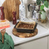 Non-stick square brownie tin with baked brownies on kitchen worktop