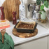 Non-stick square brownie tin with baked brownies on kitchen worktop