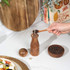 Wooden manual pepper mill with engraved Salter logo, shown upright.