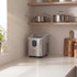 Silver countertop ice maker with clear lid shown in modern UK kitchen setting