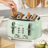 Mint green 4-slice toaster on kitchen counter with bagels in slots