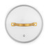 Glass saucepan lid with gold handle, shown overhead on white background