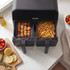 Dual drawer air fryer with chips and chicken kebabs, black finish, kitchen counter