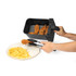 Air fryer basket serving breaded chicken and chips onto plate