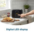 Black two-slice toaster with digital LED display on kitchen worktop