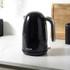 Black electric kettle with chrome handle on kitchen worktop