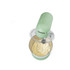 Green stand mixer with whisk attachment mixing cake batter, top view