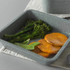 Grey speckled roasting tin with roasted sweet potato, tenderstem broccoli and mangetout.