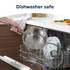 Person loading stainless steel saucepan into dishwasher in home kitchen