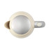 Cream electric kettle viewed from above with silver lid and handle