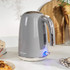 Grey electric kettle with chrome handle on kitchen counter, Salter logo visible