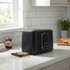 Black 2-slice toaster with crumb tray open on kitchen counter