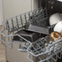 Non-stick loaf tins in dishwasher top rack, shown with mugs and glasses.