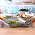 Non-stick square grill pan with handle, shown with cooked salmon, broccoli, and lemon wedge.
