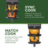 Black dual drawer air fryer with digital display, two drawers filled with cooked chips, top view
