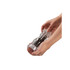 Clear acrylic pepper mill held in two hands, showing grinding action.