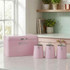 Pink bread bin and matching tea, coffee, sugar canisters on kitchen counter