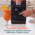 Salter drink maker with touch controls, glass of orange drink beside, in kitchen.