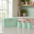 Mint green bread bin and matching tea, coffee, sugar canisters on kitchen counter