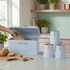 Light blue bread bin with matching tea, coffee and sugar canisters on kitchen counter