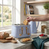 Salter blue 4-slice toaster with wood accents in kitchen, bread and toasted slice visible