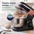 Black stand mixer with beater, mixing flour, butter and eggs in a kitchen setting
