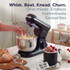 Hand adjusting dial on black kitchen appliance showing digital timer display