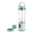Green portable blender with handle, measuring guide and two separate green lids