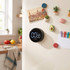 Black digital kitchen timer with large display attached to fridge door