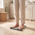 Person standing on digital bathroom scale in modern bathroom