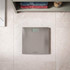Silver bathroom digital scale with display shown on tiled floor